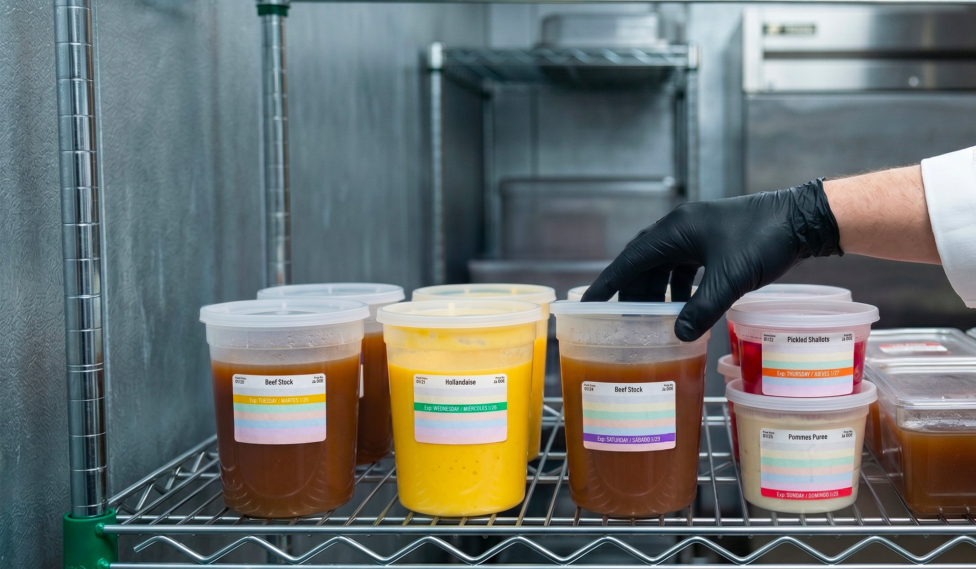 Walk-in shelf with FreshDot color-coded labels on deli containers