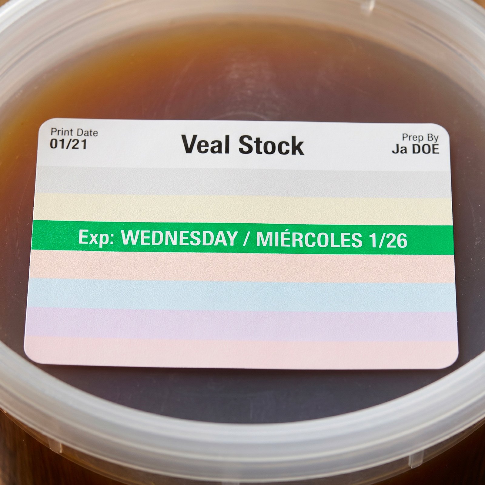 Macro close-up of a FreshDot label on a container lid