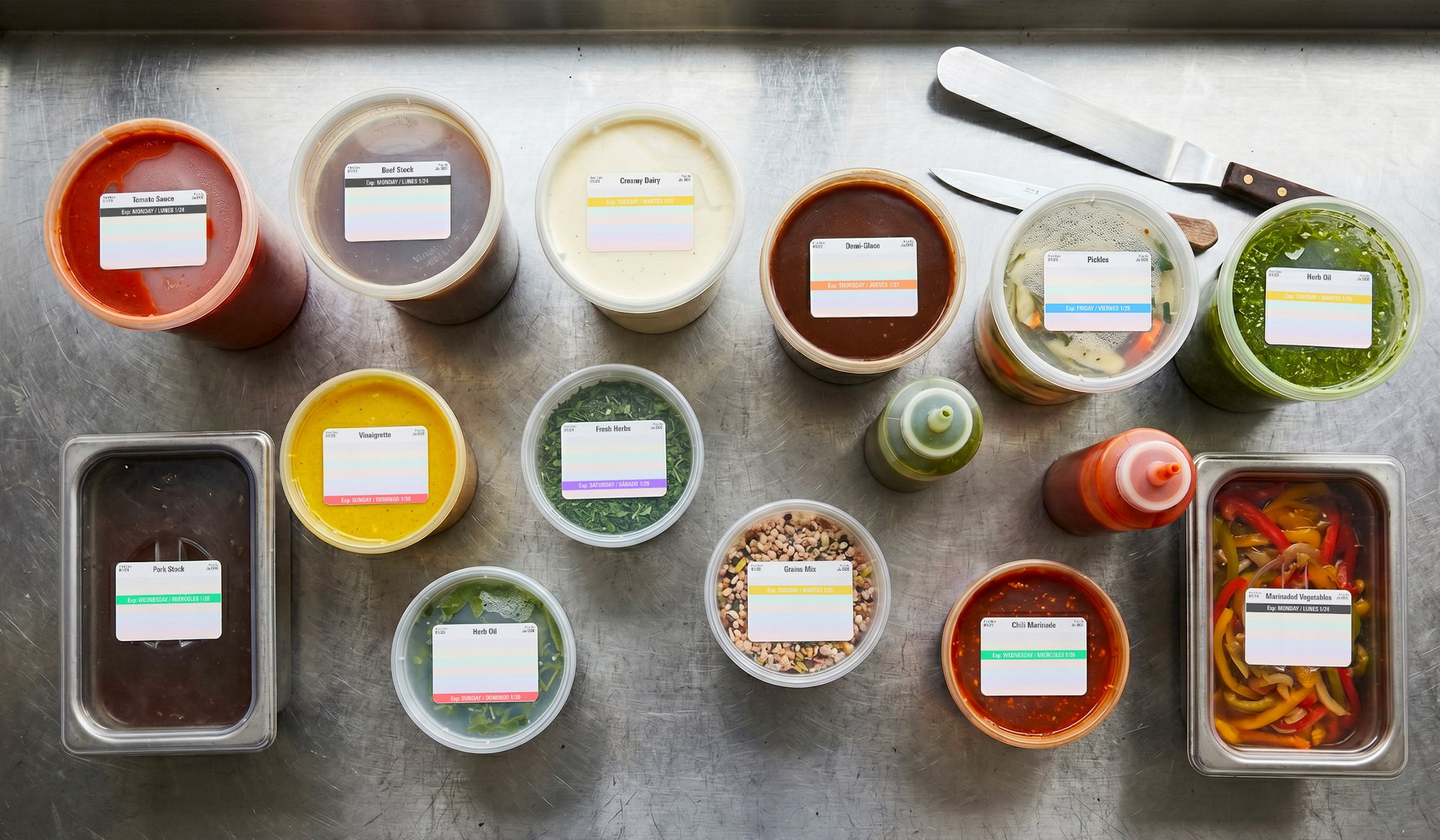 Overhead view of labeled deli containers with color-coded FreshDot system